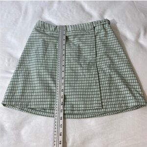 John Galt green plaid mini skirt buckle belt Brandy Melville 
ONE SIZE EUC